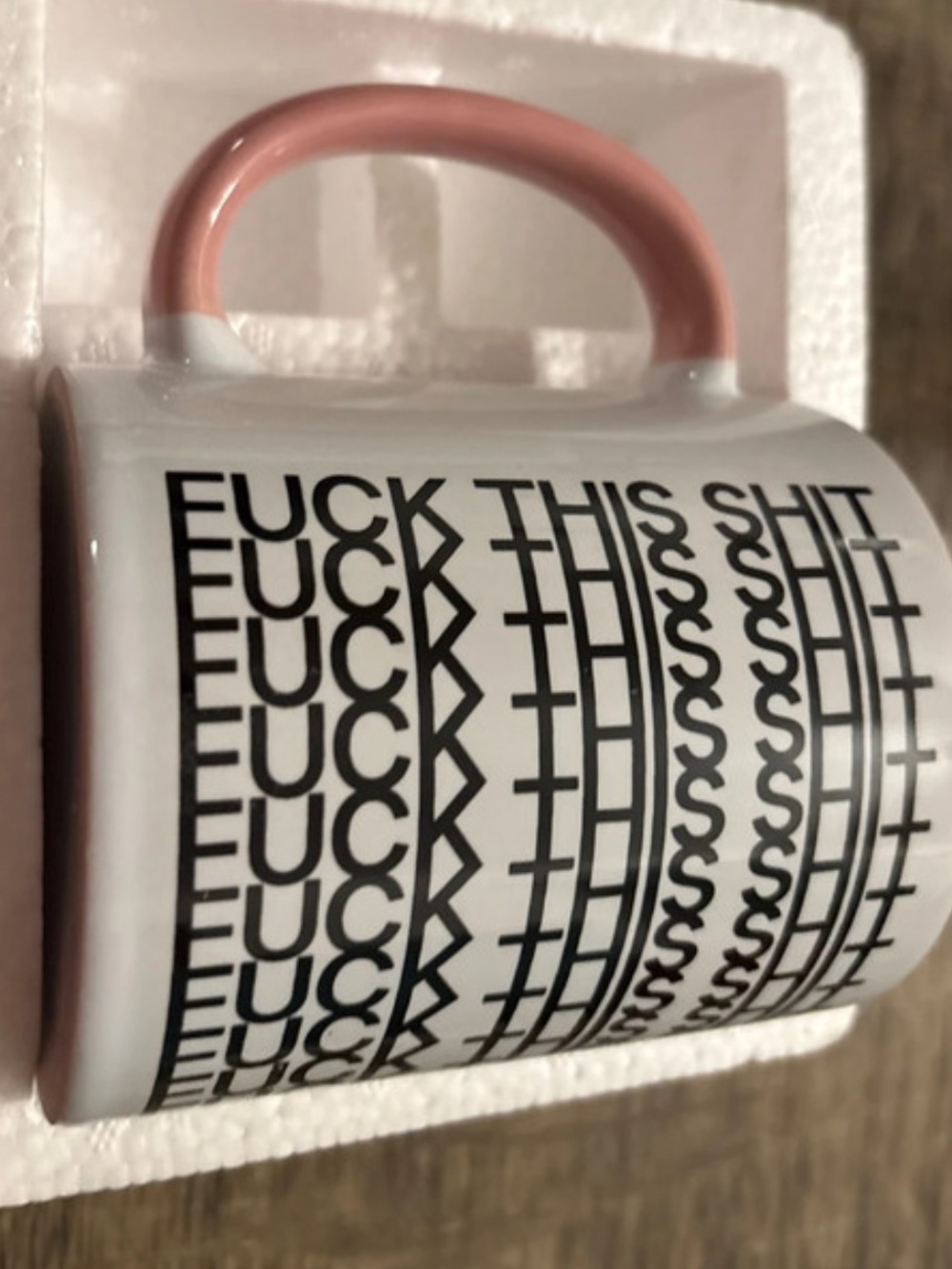 White Ceramic Mug with Pink Handle and Bold Black Graphic